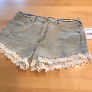 Free People denim shorts with lace trim